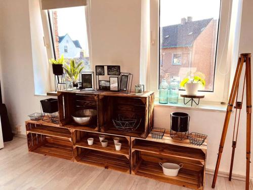 a room with a window and a wooden entertainment center at Suburban Jungle in Bochum