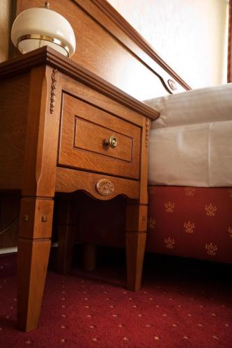 Postel nebo postele na pokoji v ubytování Hotel Korona