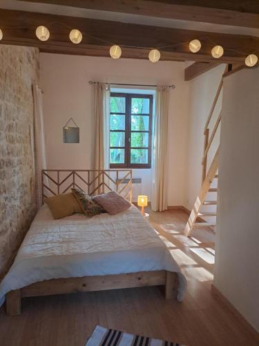 Postel nebo postele na pokoji v ubytování Le Moulin Chardet