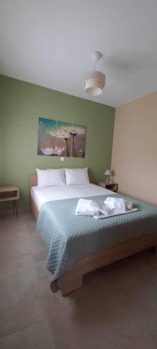 Postel nebo postele na pokoji v ubytování Aggeliki's Apartments