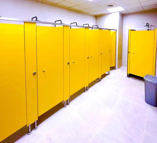 a row of yellow lockers in a room at Hostel Acacias in Madrid