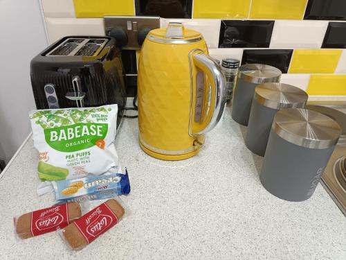 a counter top with a coffee maker and a blender at Lister Park Bradford Stylish 1bed Coach House - Quiet & Tranquil Cottage & Parking in Bradford