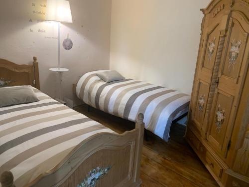 Cama ou camas em um quarto em Villa Maria Baselga di Pinè Appartamenti