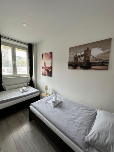 a bedroom with a bed and a bridge on the wall at Apartmány Košice in Košice