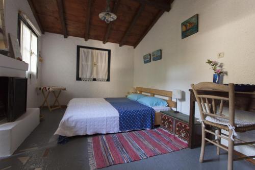 Postel nebo postele na pokoji v ubytování To Spitaki Apartments