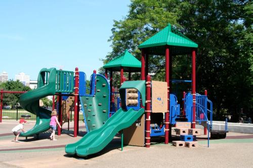 a playground with a slide in a park at Lincoln Park 3 BR Penthouse in Chicago