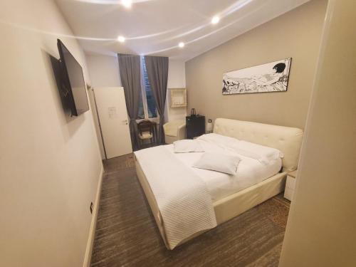 Varazze Suite Sauna e Hammamにあるベッド