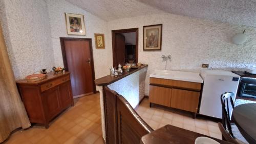 a kitchen with a sink and a dishwasher and a counter at Villa Tessa in Ronciglione