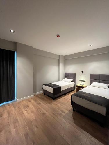 Katil atau katil-katil dalam bilik di Grand Müdüroğlu Hotel