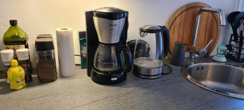 a coffee maker on a counter next to a sink at StudioRandijk in Nieuwegein