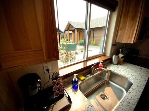 a kitchen counter with a sink and a window at Bear Mountain - Suite 6 in Grants Pass