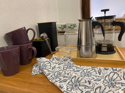 a counter top with cups and a blender on it at Mlýn Slavonice in Slavonice