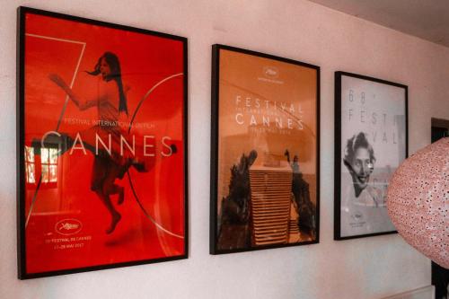 four pictures of movies hanging on a wall at Appartement de 2 chambres avec vue sur la ville piscine partagee et jardin clos a Gaillac in Gaillac