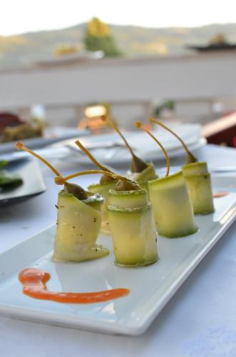 a white plate of food on a table at Ino Hotel & Suites in Samos
