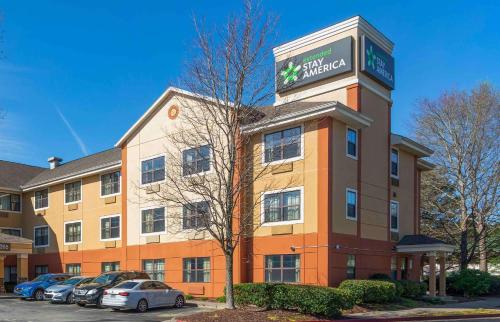 a building with a sign on the top of it at Extended Stay America Select Suites - Atlanta - Morrow in Morrow