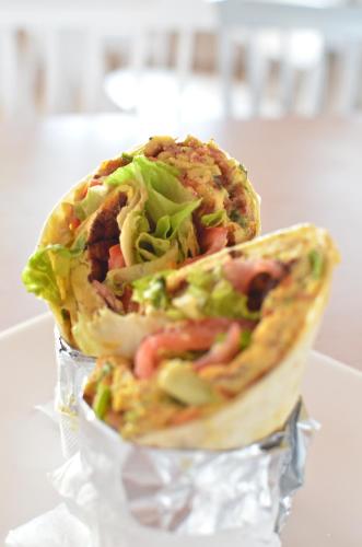 a sandwich sitting on top of tin foil at Ino Hotel & Suites in Samos