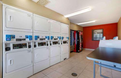 a row of washers and dryers in a garage at Extended Stay America Suites - Houston - The Woodlands in The Woodlands