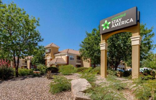 a sign in front of a building with a building at Extended Stay America Suites - Phoenix - Scottsdale - Old Town in Scottsdale