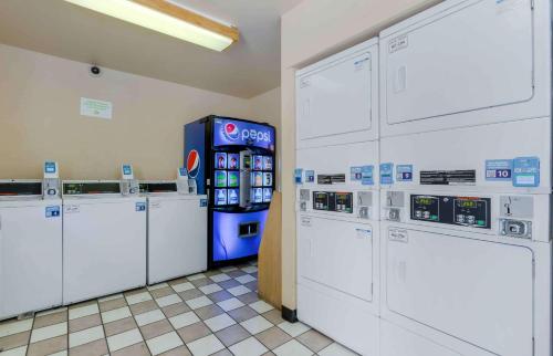 a gas station with several machines in a room at Extended Stay America Suites - Phoenix - Scottsdale - Old Town in Scottsdale