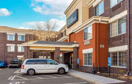 a white van parked in front of a building at Extended Stay America Suites - Minneapolis - Eden Prairie - Technology Drive in Eden Prairie
