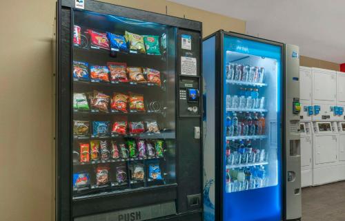 a soda vending machine in a room with drinks at Extended Stay America Suites - Stockton - March Lane in Stockton