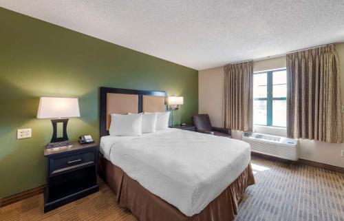 a hotel room with a large bed and a window at Extended Stay America Suites - Orange County - Katella Ave in Orange