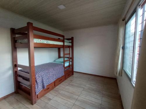 a bedroom with two bunk beds in a room at Vicenzo 2 in Melo