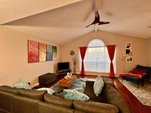 a living room with a couch and a window at Spacious Corporate Condo - 2bd/2ba in Madison