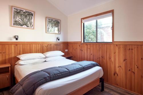 a bedroom with two beds and a window at NRMA South West Rocks Holiday Park in South West Rocks