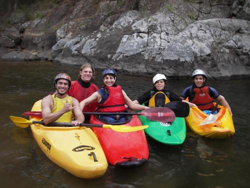 a group of people in kayaks in the water at Pousada Encontro dos Rios in Lumiar