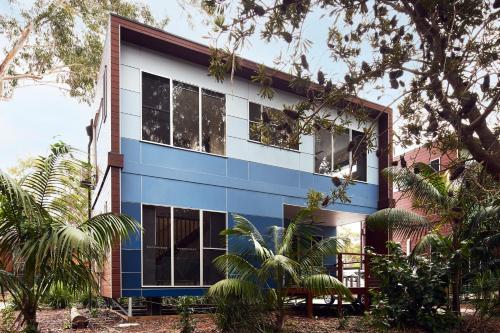 a blue and white building with trees in front of it at NRMA South West Rocks Holiday Park in South West Rocks