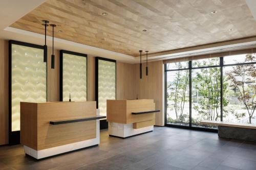 a large room with large windows and a table at Fairfield by Marriott Fukuoka Ukiha in Ukiha