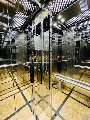 a subway station with a glass door and a bench at Hồng Anh 2 Hotel in Ha Long
