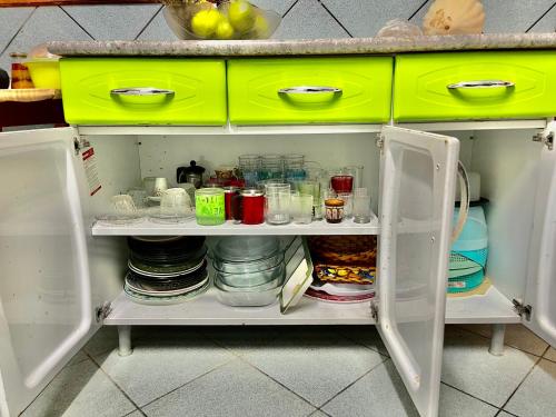 a refrigerator filled with food and other items at Casa Ilha de Itamaracá in Vila Velha