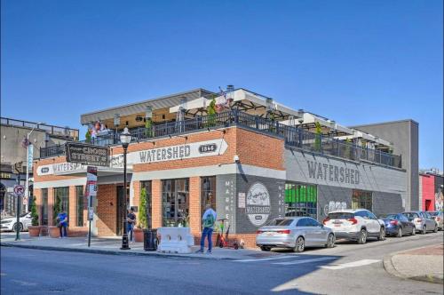 a building on a street with cars parked in front of it at Baltimore Abode, Walk to Cross Street Market! in Baltimore