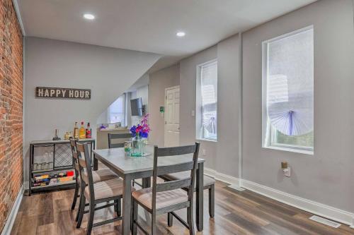 a kitchen and dining room with a table and chairs at Baltimore Abode, Walk to Cross Street Market! in Baltimore