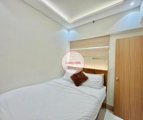 En eller flere senge i et værelse på i-STAY MNL Ria Suite 2-br Family Room Bay Area Mall of Asia Pasay City
