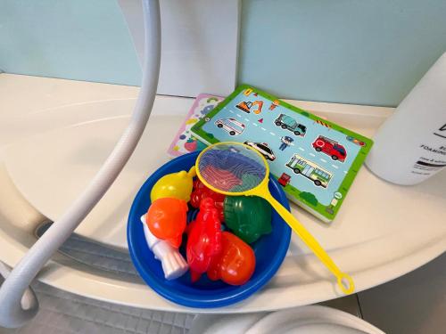 a bowl of candy on a table with a spoon at 憩いの場　ただいま〜 in Nago