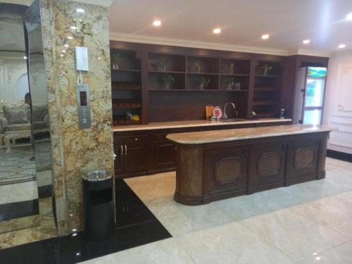 a kitchen with a island in the middle of a room at KHÁCH SẠN PHƯƠNG MINH in Hai Phong