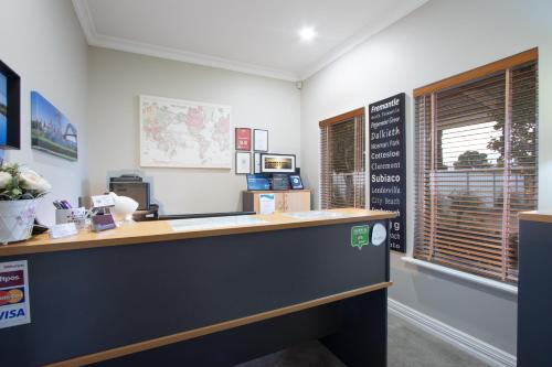 a cashier counter in an office with a window at Durham Lodge Bed & Breakfast in Perth