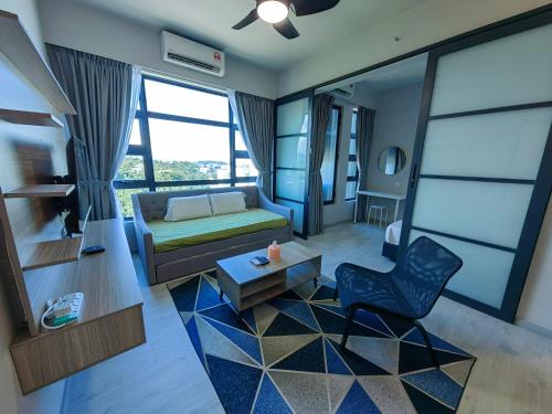 a living room with a couch and a chair at Jesselton Quay JQ Homestay # Free Parking# in Kota Kinabalu