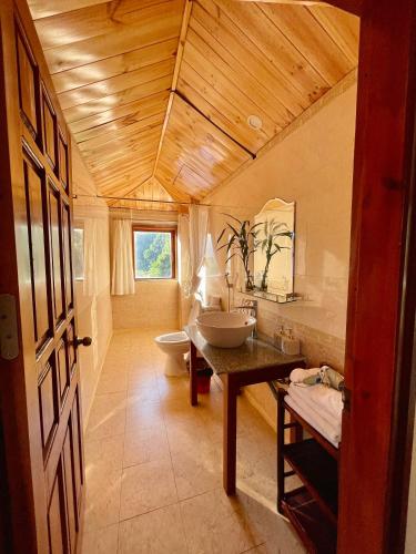 a bathroom with a sink and a toilet at Chez Loan Hotel in Ninh Binh