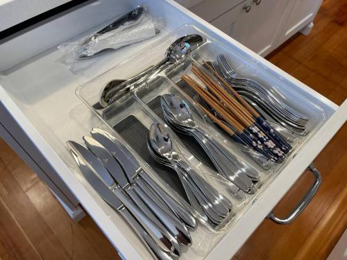 a tray of silver utensils in a drawer at The Corner Cottage in El Centro