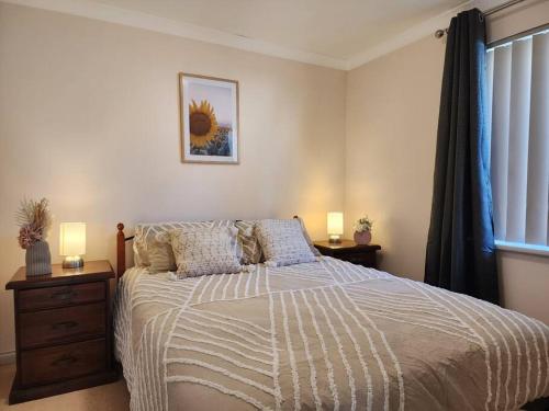 Ένα ή περισσότερα κρεβάτια σε δωμάτιο στο The Golfers Rest.