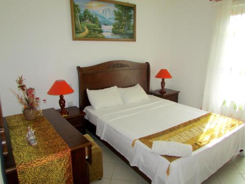 Postel nebo postele na pokoji v ubytování Golden Rod villa