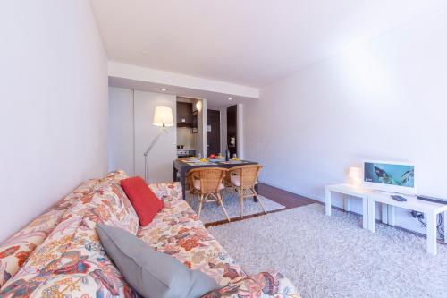 a living room with a couch and a table at Lugano Centro- Happy Rentals in Lugano