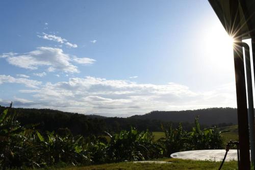 a view from the porch of a house with the sky at Hilltop Retreat - best of both worlds: Beach/farm in Pillar Valley
