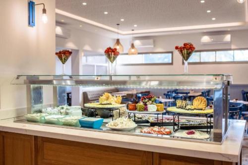 a buffet line with many different types of food at Nachsholim Kibbutz Country Lodging in Nachsholim