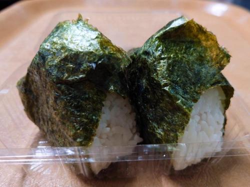 a plastic container with some food on top of rice at Hakodate Yunokawa Hotel Amamiyakan in Hakodate
