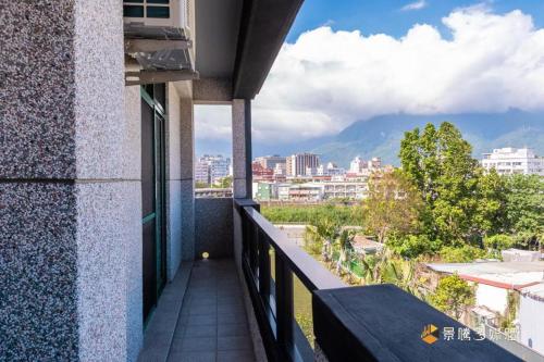 a balcony with a view of a city at 快樂狗寵物民宿--證號2598 in Hualien City